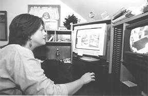 Observing her child through a Cranston day carecenter's Web site is Deborah B. Epstein. Observing her child through a Cranston day care<br>center's Web site is Deborah B. Epstein.