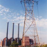 Latest energy users to benefit from price cuts Smoke stacks and power lines atNarragansett Electric in Providence.