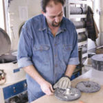 For its faithful clientele, Jeweled Cross forges ahead Lon Hargraves working at JeweledCross Company in North Attleboro.