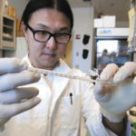 Science shines in Jewelry District Fred Lee working at the Galletti Building's Centerfor AIDS research.