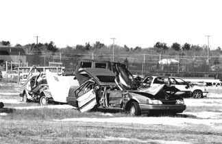 Abandoned cars and debris are an all too familiar siteat Quonset Point/Davisville. Abandoned cars and debris are an all too familiar site<br>at Quonset Point/Davisville.