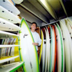 Tom Hogan, co-owner of Warm Winds, a surf shopin Narragansett.