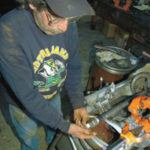 Fire safety a primary issue Ron Bosclair of Allied Fire Protectionin West Warwick assembles a sprinklersystem.