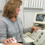 Jane Tetreault performs an ultrasound ona patient which produces a video or photo.