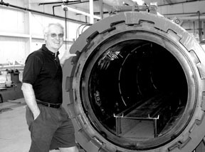 Eric Hall, president of Hall Spars & Rigging, displayshis company's autoclave. Eric Hall, president of Hall Spars & Rigging, displays<br>his company's autoclave.