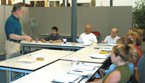 Steven Ussach teaches a language class at Quaker Fabrics in Fall River. Steven Ussach teaches a language class at Quaker Fabrics in Fall River.