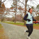 A jogger enjoys a run on Blackstone Boulevardin Providence.