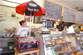 Robin Dwyer, an employer at The Picnic Basket, fillsa deli order at the Narragansett business. Robin Dwyer, an employer at The Picnic Basket, fills<br>a deli order at the Narragansett business.