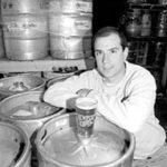 Brent Ryan, co-owner of Middletown-based Coastal Extreme Brewing Co.,poses in the keg room.