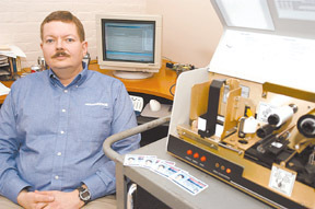 Chris Rothwell, vice president of engineering besideAtlantek's ID-card printer. Chris Rothwell, vice president of engineering beside<br>Atlantek's ID-card printer.