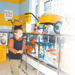 Max Gilley peruses the toys at the newrisd!kids store downtown.