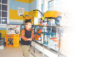 Max Gilley peruses the toys at the newrisd!kids store downtown. Max Gilley peruses the toys at the new<br>risd!kids store downtown.