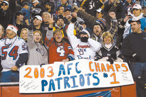 Patriots fans celebrate the team's victory overBuffalo in December. Patriots fans celebrate the team's victory over<br>Buffalo in December.