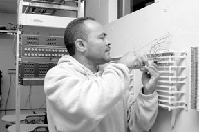 Luis Baez works on an exercise at a class held bythe R.I. chapeter of IBEW. Luis Baez works on an exercise at a class held by<br>the R.I. chapeter of IBEW.
