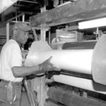 Al Smith processes sheets of rubber at Warren-basedLloyd Manufacturing.