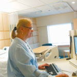 A Newport Hospital nurse searches for informationon one of the many computers added.