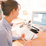 The Voice Tracker, pictured above between the keyboard and computer screen, features a voice-recognition microphone for comuter dictation.