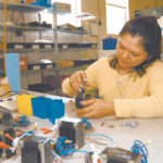 Bracing for federal cuts Emma Guzman of Crafford-Laserstar, East Providence, which faces increased manufacturing costs due to proposed federal funding cuts.