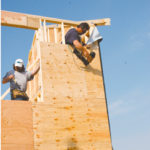 Mike Kane and Kevin Chaisty help construct a home in Rumford.