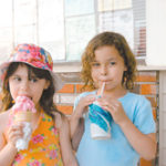 Creameries take a licking Samantha and Racquel Rodriguez enjoy ice cream treats at Hilltop Creamery in East Greenwich.