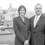 Jill Schlesinger and David Brochu from the roof of the StrategicPoint office at 220 West Exchange St. in downtown Providence. 