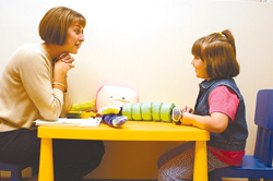 Speech pathologist Andrea Domingos works with Olivia Phillips, a 6-year-old from Coventry, at the South County Speech & Language Center in North Kingstown. Speech pathologist Andrea Domingos works with Olivia Phillips, a 6-year-old from Coventry, at the South County Speech & Language Center in North Kingstown.