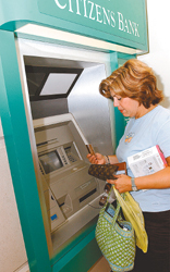 Lisa Regan, of Cumberland, withdraws her card from an ATM at Warwick Mall. Lisa Regan, of Cumberland, withdraws her card from an ATM at Warwick Mall.