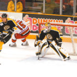 P-Bruin defensemen Milan Jurcina clears the Bruins' zone. The team is not anticipating an attendance boost despite the NHL lockout. 