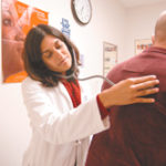 Free clinics catch insurance break Photo by Frank MullinDr. Sophia Gandhi examines a patient at the R.I. Free Clinic, where more than 1,300 uninsured adults receive care and the staff mainly consists of volunteers.