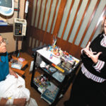 Photo by Brian McDonaldArtist and cancer survivor Diane Gregorie talks with cancer patient Carol Khole about her Bottles of Hope at Rhode Island Hospital. 