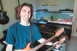 <B>Photo by Frank Mullin</b>Tony Ricci in his Woonsocket recording studio, which is equipped with such <B>Photo by Frank Mullin</b><br>Tony Ricci in his Woonsocket recording studio, which is equipped with such