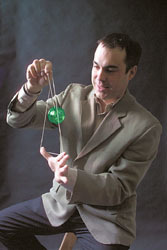 <b>Photo by Brian McDonald</b>Yomega marketing director John Marcantonio shows his yo-yo handiwork at the company's Fall River facility. Yomega signed a distribution contract with Hasbro. <b>Photo by Brian McDonald</b><br>Yomega marketing director John Marcantonio shows his yo-yo handiwork at the company's Fall River facility. Yomega signed a distribution contract with Hasbro.
