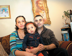 <b>Photo by Frank Mullin</b>The Ochoa family of Central Falls strives to manage rising health care costs. Guillermo Ochoa, an uninsured diabetic, is seen here with his wife Johanna Flores and daughter Kelly. <b>Photo by Frank Mullin</b><br>The Ochoa family of Central Falls strives to manage rising health care costs. Guillermo Ochoa, an uninsured diabetic, is seen here with his wife Johanna Flores and daughter Kelly.