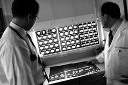 <b>Photo by Frank Mullin</b>Radiation Oncology Assiciates Inc. doctors examine the X-ray images of a patient. The Providence-based radiation cancer treatment center could see up to 100 patients a day. <b>Photo by Frank Mullin</b><br>Radiation Oncology Assiciates Inc. doctors examine the X-ray images of a patient. The Providence-based radiation cancer treatment center could see up to 100 patients a day.