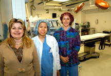 Kent Hospital has looked overseas to boost its nursing ranks. From left, local nurse Terri Dulude, Melissa Ancanan, from the Phillipines, and Michelle Brittian, from Australia, stand at one of the operating rooms at Kent Hospital. <br>Kent Hospital has looked overseas to boost its nursing ranks. From left, local nurse Terri Dulude, Melissa Ancanan, from the Phillipines, and Michelle Brittian, from Australia, stand at one of the operating rooms at Kent Hospital.