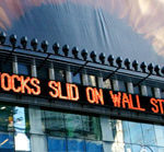A News Ticker in New York City reports a bad day on Wall Street.