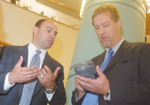 <b>JOHN HALL</b>, left, from Vox Tec, shows a Phraselator to Merril Thomas, Providence Community Health Center CEO. <b>JOHN HALL</b>, left, from Vox Tec, shows a Phraselator to Merril Thomas, Providence Community Health Center CEO.