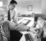 POINTMAN: Dr. Phillip G. Maddock, left, owner of Maddock Center for Radiation Oncology in Warwick.