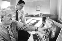 <b>POINTMAN:</b> Dr. Phillip G. Maddock, left, owner of Maddock Center for Radiation Oncology in Warwick. <b>POINTMAN:</b> Dr. Phillip G. Maddock, left, owner of Maddock Center for Radiation Oncology in Warwick.