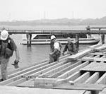 Allens Ave. developer buys tour boat WORKERS REPAIR DOCKS at Conley's Wharf in Providence.