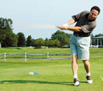 Whether for charity or fun, golf events a big hit Vinnie Sandonato tees off at the Alpine Country Club last Monday in a charity golf tournament.