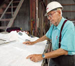Luther H. Blount, 88, still works at his boat building facility in Warren.