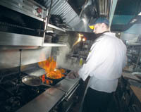 <b>Turning up the heat:</b> Big Fish head chef Dave Jackson cooks up a dish at the Providence restaurant. <b>Turning up the heat:</b> Big Fish head chef Dave Jackson cooks up a dish at the Providence restaurant.