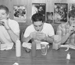 Study sizes up the ‘freshman 15’ Bloomberg News Photo
Trough line: From left, Justin Kadis, John Intrater and Robert Dermer, summer interns at a sports marketing firm in New York, take their lunch break at Burger Joint. A Brown University researcher is currently studying the eating habits of college students.