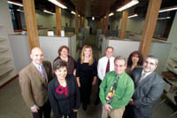 <b>New digs:</b> The staff at Shechtman, Halperin Savage shows off its new offices in a converted mill building in Pawtucket. <b>New digs:</b> The staff at Shechtman, Halperin Savage shows off its new offices in a converted mill building in Pawtucket.