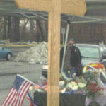 PBN photo from March 3, 2003The site of The Station Nightclub in West Warwick became a makeshift memorial after the tragedy, with many visitors pausing to leave flowers and say a prayer.