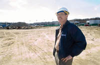 PBN photo/Stephanie Ewens<b>David Sluter,</b> owner of New England Construction, visits the site of one of his biggest ongoing projects, at Inskip Auto Mall inWarwick. Behind Sluter will be the new BMW building at the auto dealership. PBN photo/Stephanie Ewens David Sluter, owner of New England Construction, visits the site of one of his biggest ongoing projects, at Inskip Auto Mall in Warwick. Behind Sluter will be the new BMW building at the auto dealership.