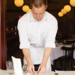 Employers reach out to ‘Gen Y’ PBN photo/Stephanie Ewens
Michael Wiseman, 24, who works as a server at Red Stripe, a bistro on the East Side of Providence, resets tables after the lunch rush.