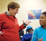 Dorcas Place makes literacy a workplace issue PBN photo/Stephanie EwensBrenda Dann-Messier gets excited for Sonya Vazquez of Pawtucket, who has been studying at Dorcas Place for a couple of months.
