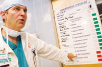 PBN Staff photo/Stephanie Ewens
<b>Dr. Harry Sax,</b> chief surgeon at The Miriam Hospital, explains a checklist of items that help prioritize operating room procedures. PBN Staff photo/Stephanie Ewens<br><br>
<b>Dr. Harry Sax,</b> chief surgeon at The Miriam Hospital, explains a checklist of items that help prioritize operating room procedures.